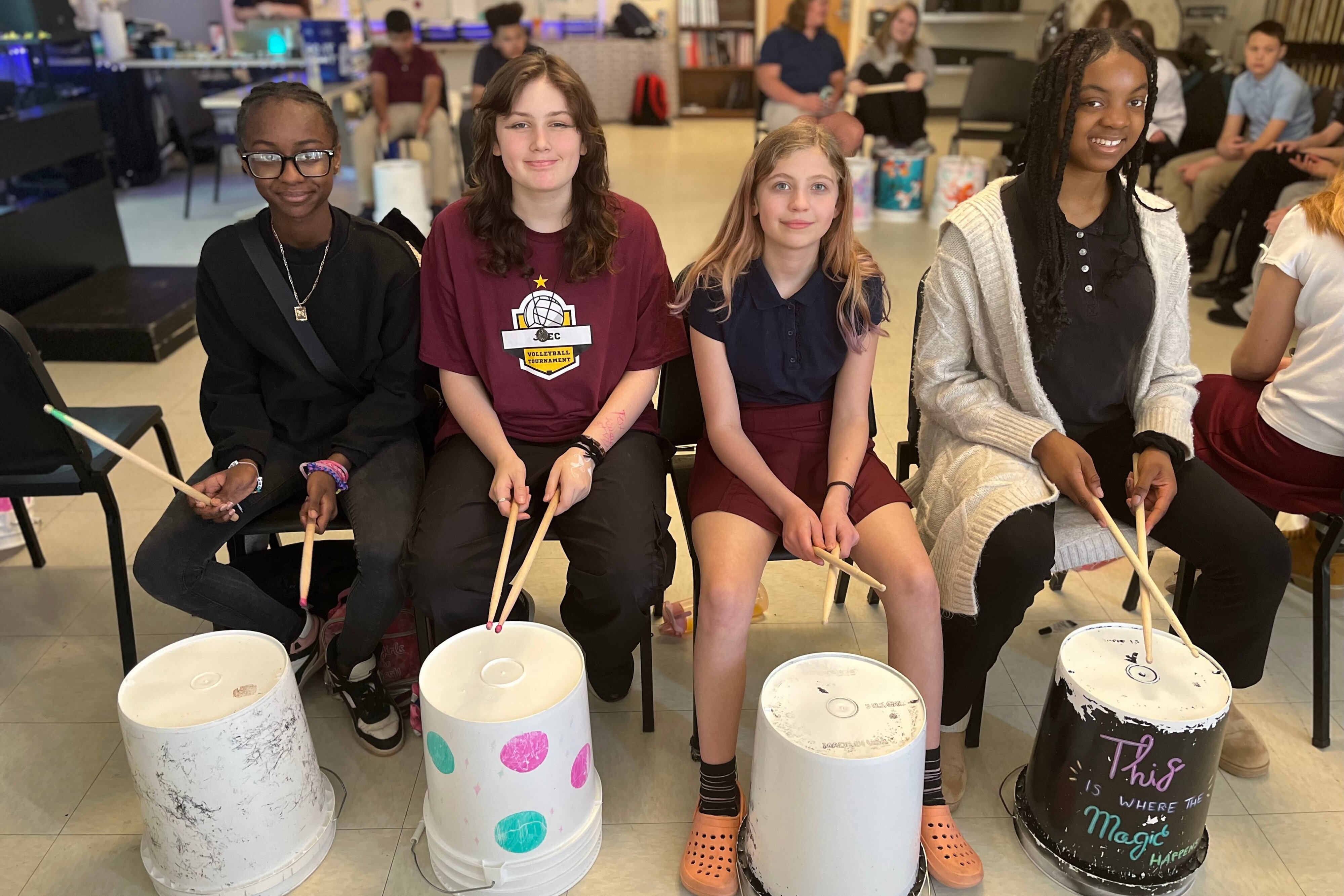 4 Jackson Preparatory & Early College female students bucket-drumming